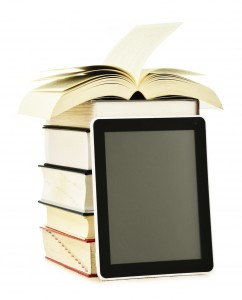 Composition with books and tablet computer isolated on white background